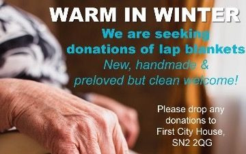 Text reading: 'Warm in Winter, we are seeking donations of lap blankets. New, handmade & preloved but clean welcome!' over an image of an elderly person's torso, hand and lap with a warm blanket on them